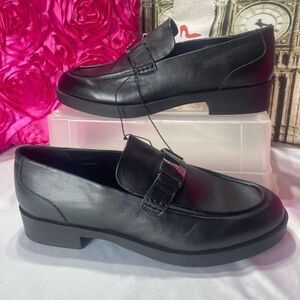 DKNY Black Slip On Loafers br With‎ silver buckle logo, women's size 11